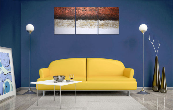 copper artwork triptych painting on blue wall