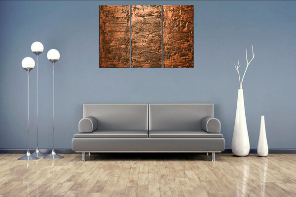 copper wall art on grey wall