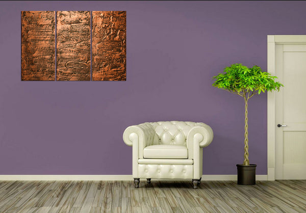 copper wall art on purple bg