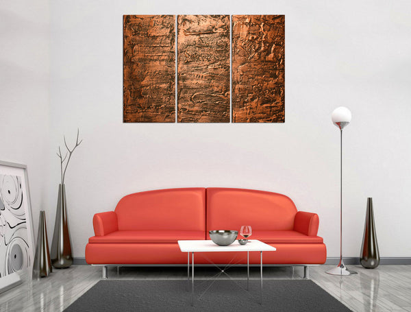 copper wall art red sofa