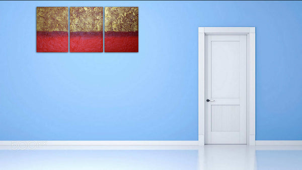 3 piece painting in gold on blue wall