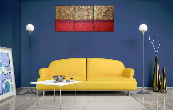 3 piece painting in gold on blue wall