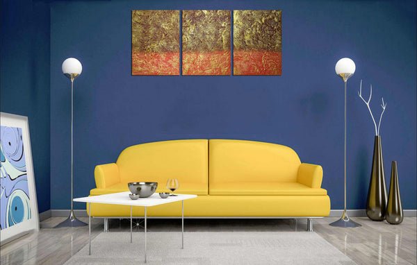 blue wall with 3 piece painting  on