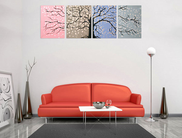 cherry blossom tree painting on living room wall with red sofa