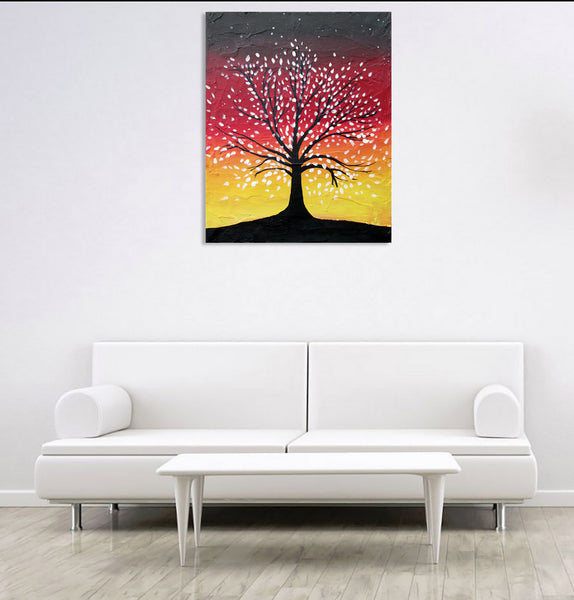 white wall with abstract tree painting in red yellow brown