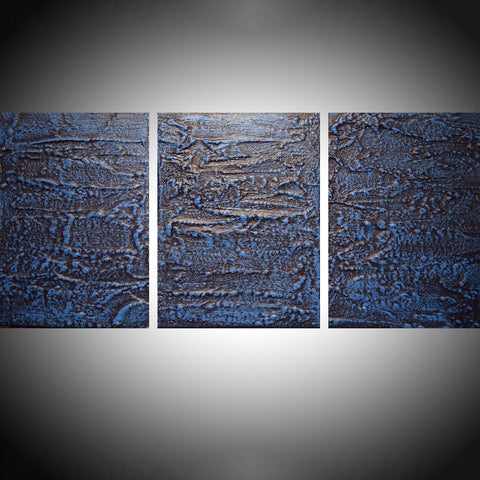 abstract blue paintings in a triptych canvas style on a grey background