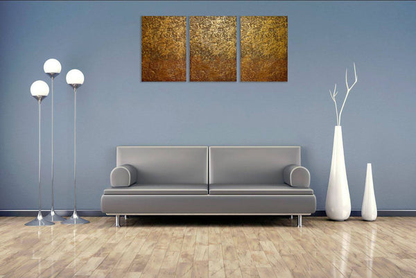 oversized metal wall art triptych art Gold Mystery canvas triptych on blue wall