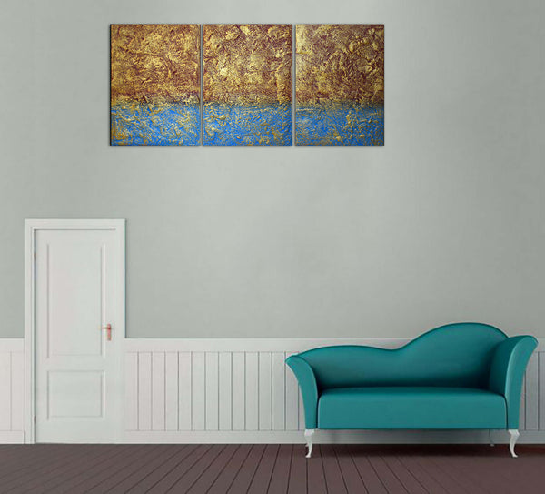 3 piece painting in gold on grey wall