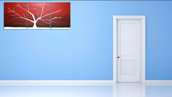 red artwork tree in white on blue wall