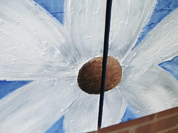 hand painting flower on a wall in blue