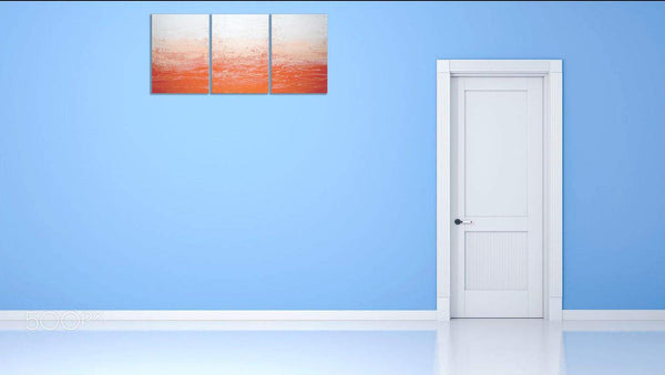 Tangerine Triptych orange abstract painting on canvas on blue wall 